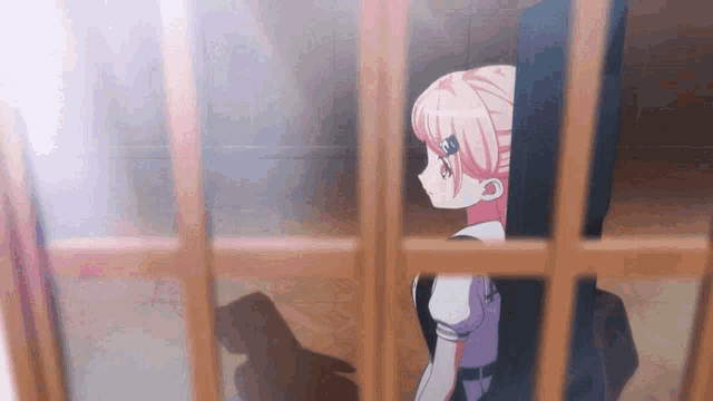 a girl with pink hair is looking out of a window
