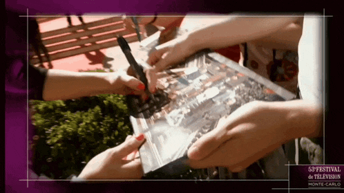 a group of people holding a piece of paper that says monte-carlo