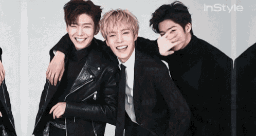 a group of young men are posing for a picture with instyle written on the bottom right