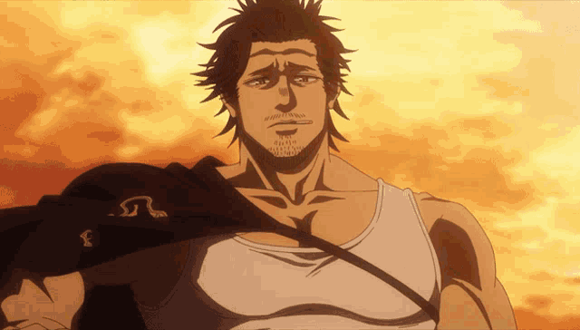a man with a beard and a white tank top has a symbol on his shoulder