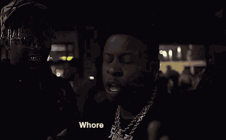 two men are standing next to each other in a dark room with the words lil bitch below them