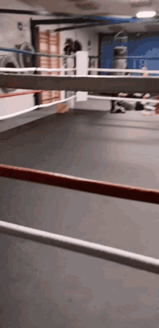 a boxing ring with a red and white rope in the middle
