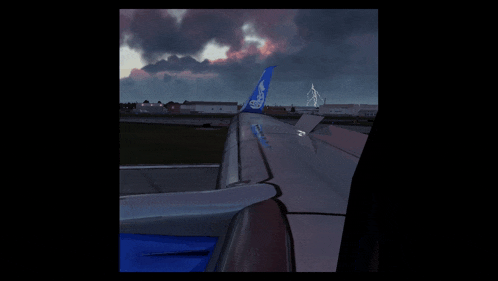 a blue and white airplane wing with the word jetblue on it