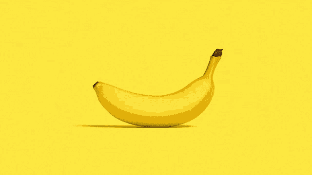 a yellow banana on a yellow background that looks like a smiley face