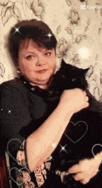 a woman is holding a black cat in her arms with hearts around her and the word cop cut in the corner