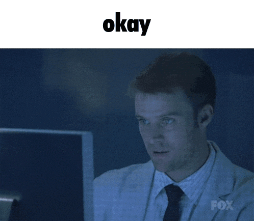 a man in a lab coat is giving a thumbs up in front of a computer screen that says fox