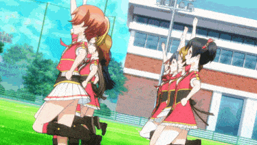 a group of anime girls are standing in front of a building