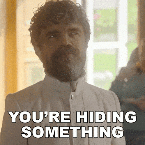a man with a beard and curly hair says you 're hiding something