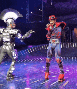 a man wearing roller skates and a red hat stands on stage