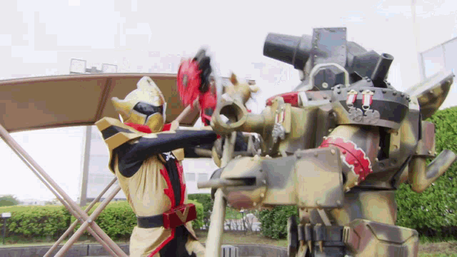 a ninja fighting a robot with a x on his chest