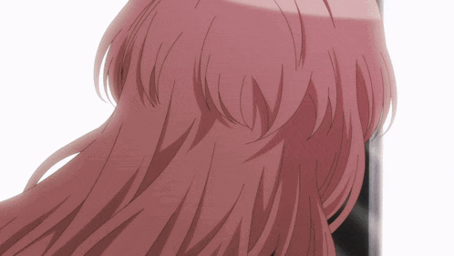 a close up of a person 's pink hair