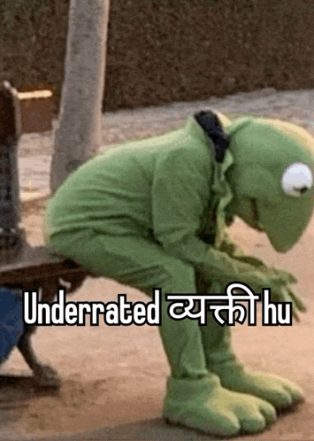 a kermit the frog is sitting on a bench with the words underrated written on the bottom