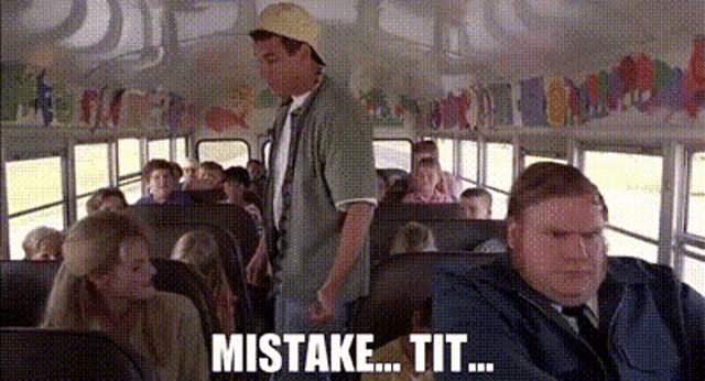 a man in a hat is standing in a school bus talking to a group of people .