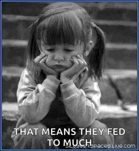 a little girl is sitting on a set of steps with her hands on her face .