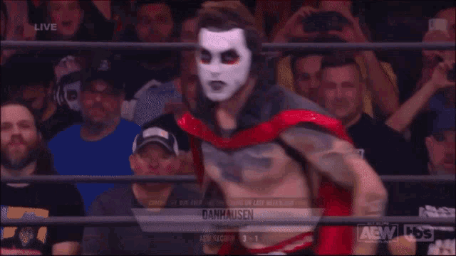 a person holding a sign that says very nice very evil on it