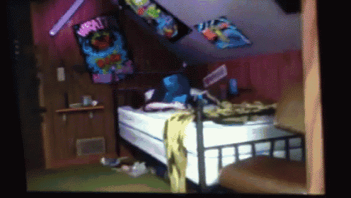 a bedroom with a bed and a blanket that says " i love you "