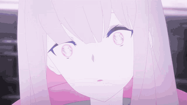 a close up of a girl with pink eyes