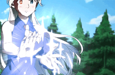 a girl with white hair and a blue shirt is holding something in her hands