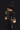 a blurry picture of a person in a dark room holding a gun .