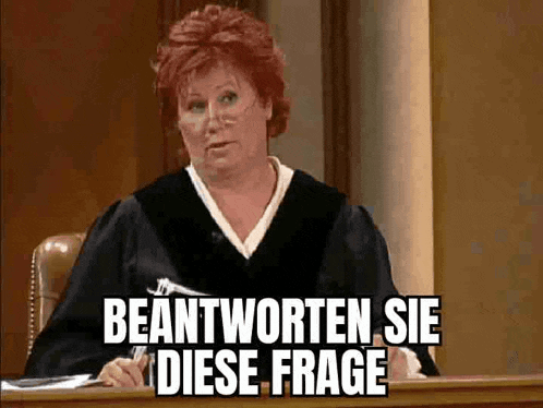 a woman in a judge 's robe is sitting at a desk with the words beantworten sie diese frage written above her