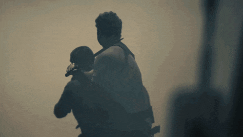 a man is carrying another man in his arms with the caption lionolfy_queen below him
