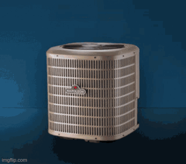 a man wearing a yellow hard hat is working on an air conditioning unit