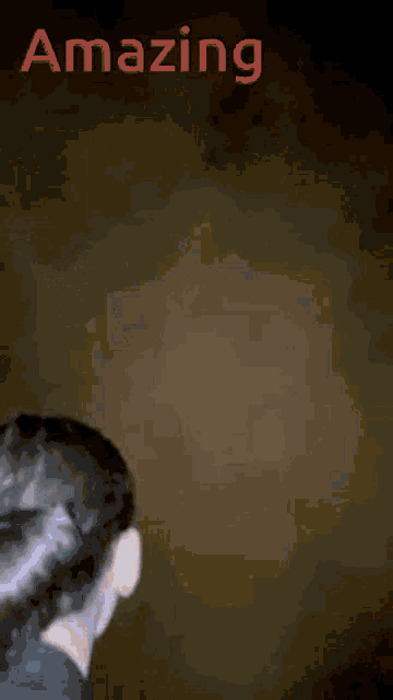 a blurred image of a person with the word amazing behind them