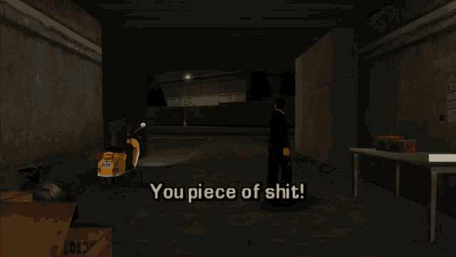a man in a suit and tie stands in a dark room with the words you piece of shit
