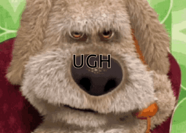 a close up of a stuffed animal with the word ugh written on it