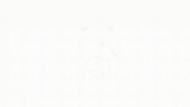 a red circle with a white circle in the middle on a white surface