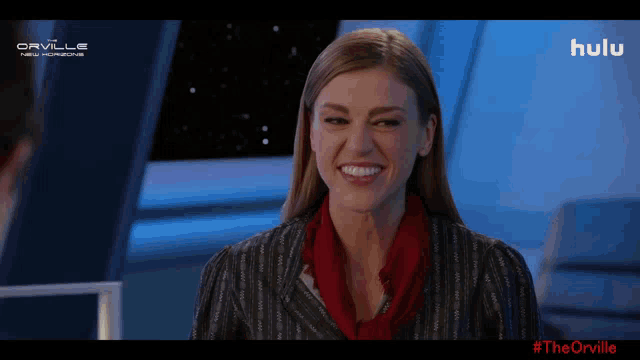 a man in a sheriff 's vest is smiling in front of a screen that says #theorville