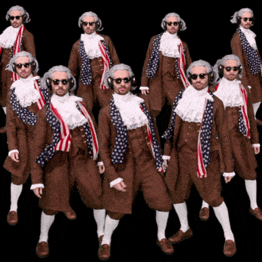 a group of men dressed in historical costumes are standing in a row