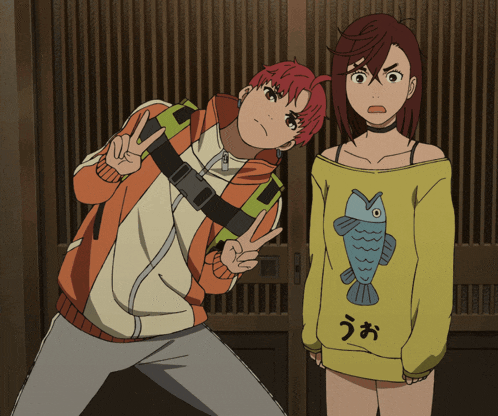 a girl wearing a yellow sweater with a fish on it stands next to a boy wearing an orange jacket