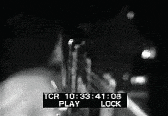 a black and white photo of a person playing a trumpet with a tcr displayed in the corner