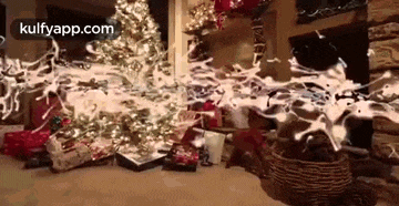 a christmas tree with a lot of presents underneath it