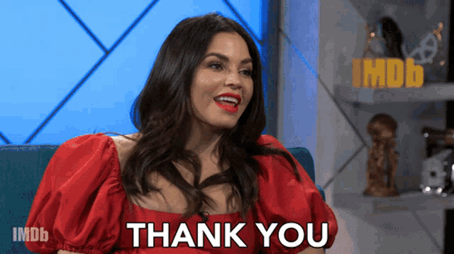 a woman in a red dress says thank you on imdb