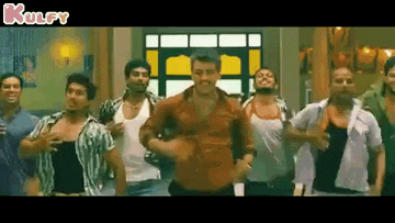a group of men are dancing together in a room in a movie .