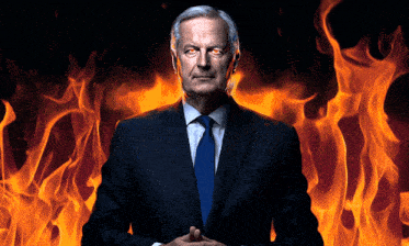 a man in a suit and tie stands in front of a fire