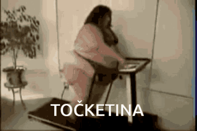 a woman is on a treadmill with the word tocketina written on the bottom