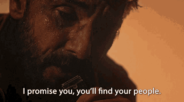 a man with a beard is holding a razor and says i promise you you 'll find your people