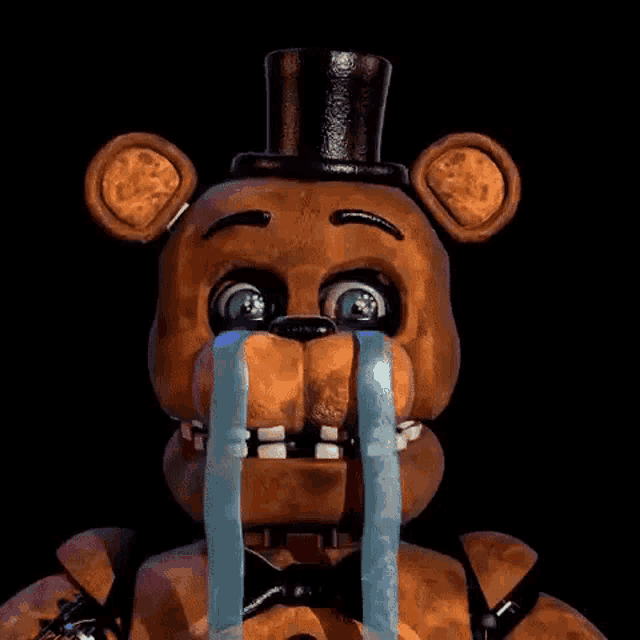 freddy fazbear from five nights at freddy 's is crying with tears coming out of his eyes and mouth .