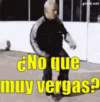 a man is jumping in the air with the words no que muy vergas in yellow letters