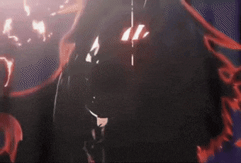 a close up of a person 's face with a glowing red eye .