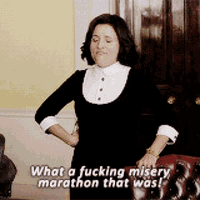 a woman with her hands on her hips says what a fucking misery marathon that was !