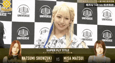 a woman is standing in front of a wall with the words super fly title written on it