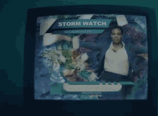 a television screen shows a storm watch for saturday at 5:00 pm