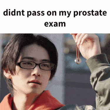 a man wearing glasses is holding a coin with the caption " didnt pass on my prostate exam " above him