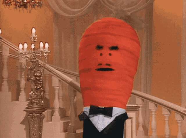 a carrot in a tuxedo and bow tie