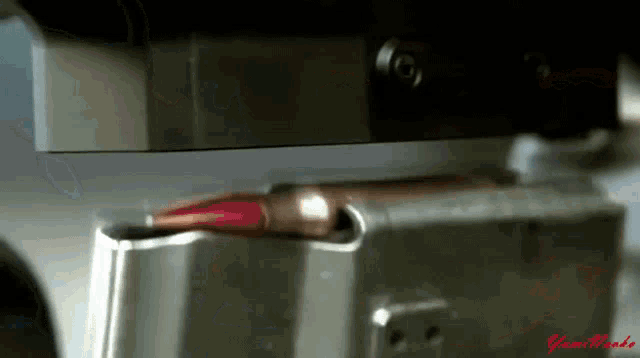 a bullet is being loaded into a gun and the word gun blade is on the bottom right corner