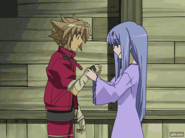 a couple of anime characters standing next to each other with gifs.com at the bottom of the image